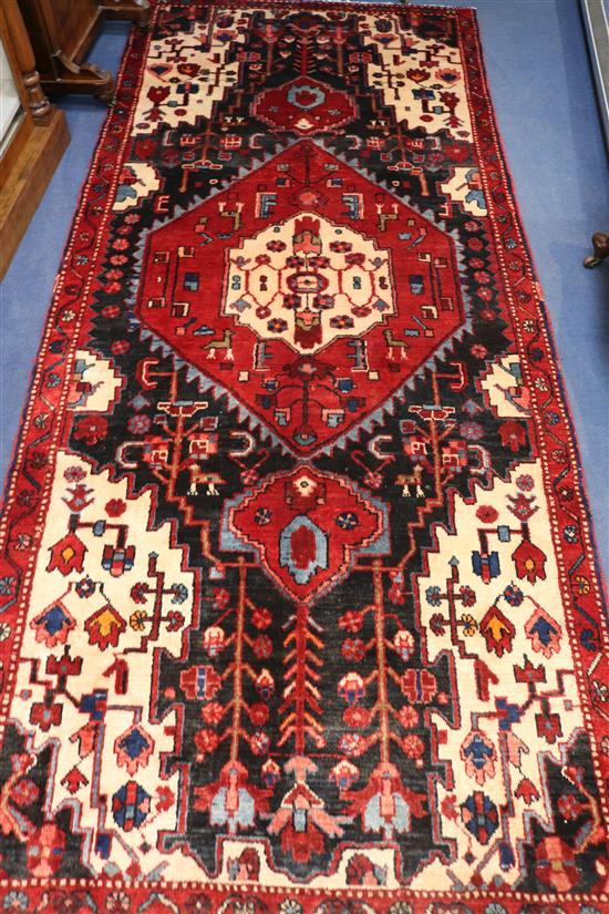 A Hamadan rug, 283cm x 120cm